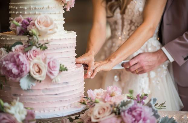 Close Up of Wedding Cake With Flowers