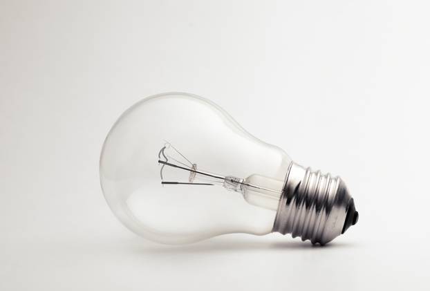 Transparent light bulb on a white background.