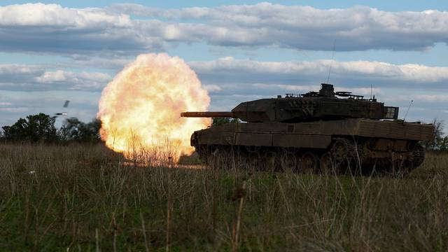 Ukrainian servicemen fire a Leopard 2A6 tank during a military exercise in Donetsk region