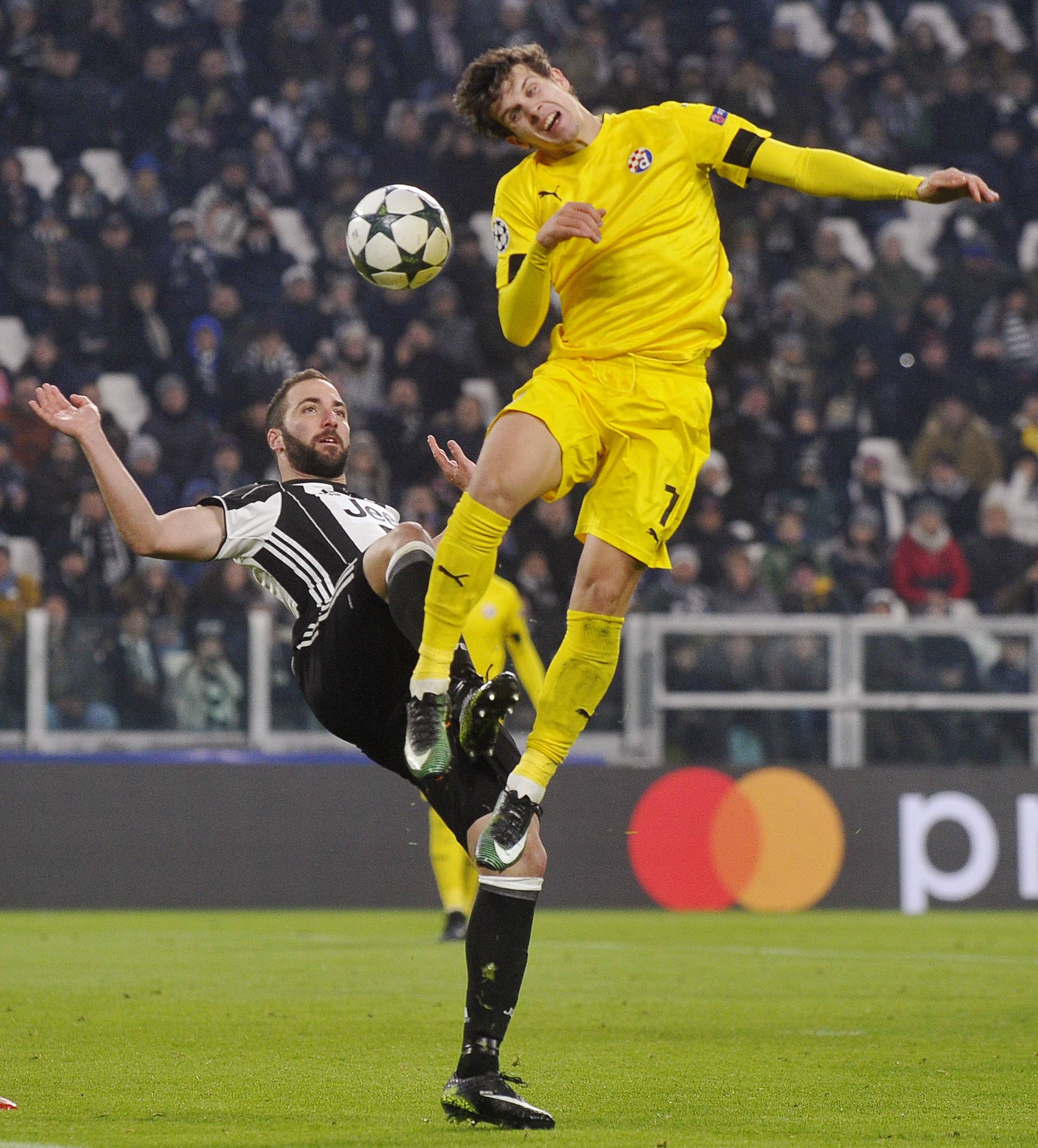 Dinamo Zagreb's Mario Situm in action with Juventus' Gonzalo Higuain