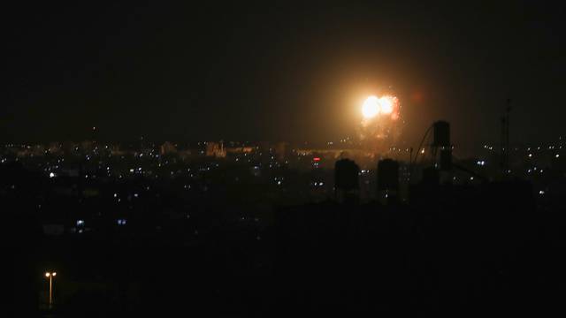 Smoke and flames are seen after an Israeli air strike in the northern Gaza Strip