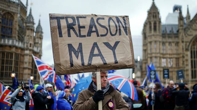Pro-Brexit and anti-Brexit protesters demonstrate outside the Houses of Parliament in London