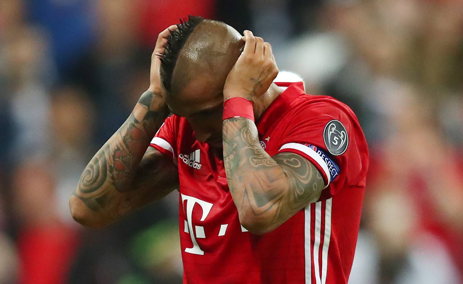 Bayern Munich's Arturo Vidal looks dejected after missing a penalty