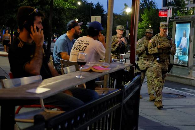 Members of the Ohio National Guard wear their sidearms while patrolling in Washington