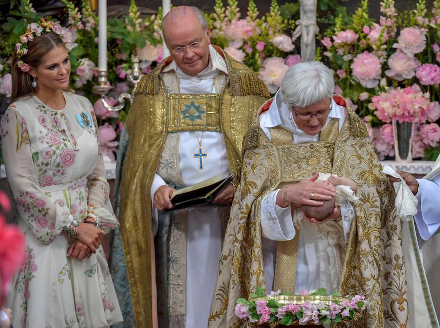 Princess Madeleine, Chief Court Chaplain Bishop Johan Dalman and Officiant  Archbishop Antje Jackelen are seen during  princess Adrienne's christening ceremony in Drottningholm Palace Chapel outside Stockholm