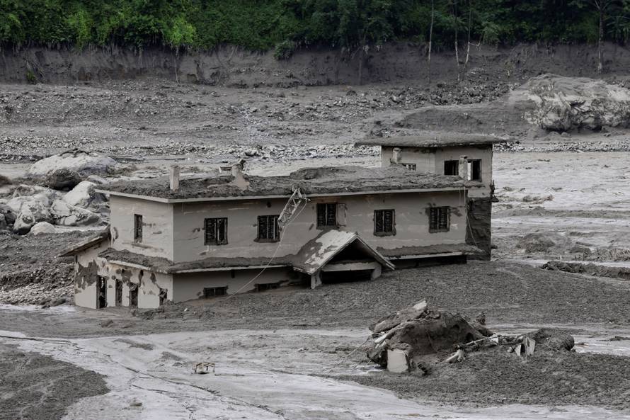 A mud-covered building following a flash flood at Trishuli, Nepal
