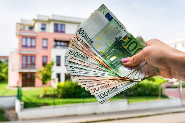 Property,Buyer,Holding,Euro,Banknotes,And,Buying,Beautiful,House,From