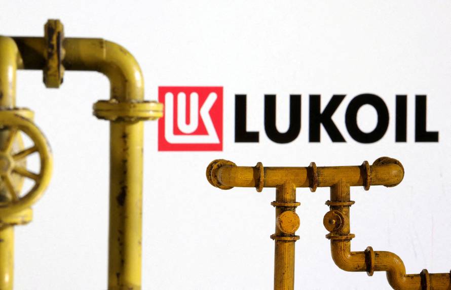 FILE PHOTO: Illustration shows natural gas pipeline and Lukoil logo