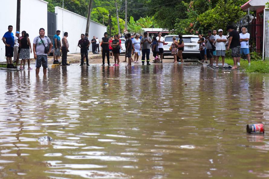 Torrential rains burst rivers, sparking floods in eastern Mexico