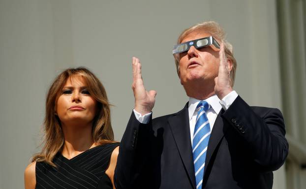 U.S. President Trump and Melania Trump watch the solar eclipse from the White House in Washington