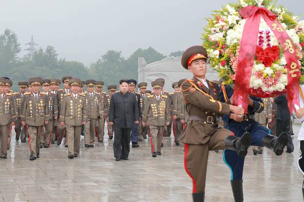 North Korean leader Kim Jong Un visits war graves to pay respects to war dead for the 64th anniversary of the armistice which ended the Korean War, in this undated photo released by KCNA