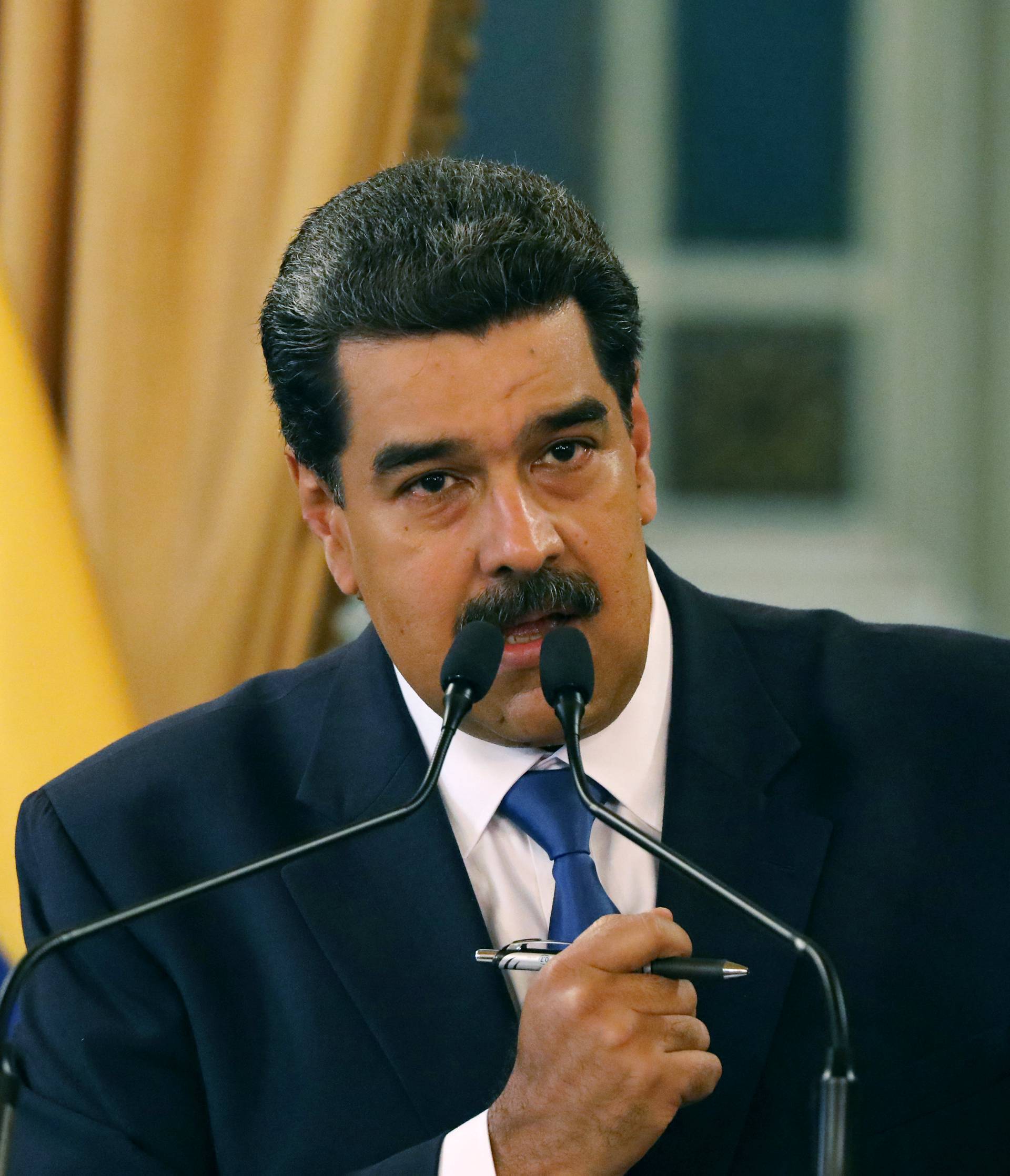 Venezuela's President Nicolas Maduro gestures during a news conference at Miraflores Palace in Caracas