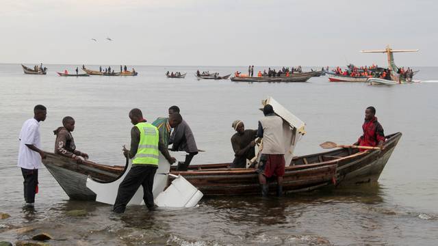 Rescuers attempt to recover the Precision Air passenger plane that crashed into Lake Victoria in Bukoba