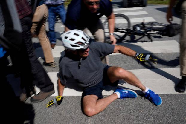 U.S. President Joe Biden falls during a bike ride in Rehoboth Beach, Delaware