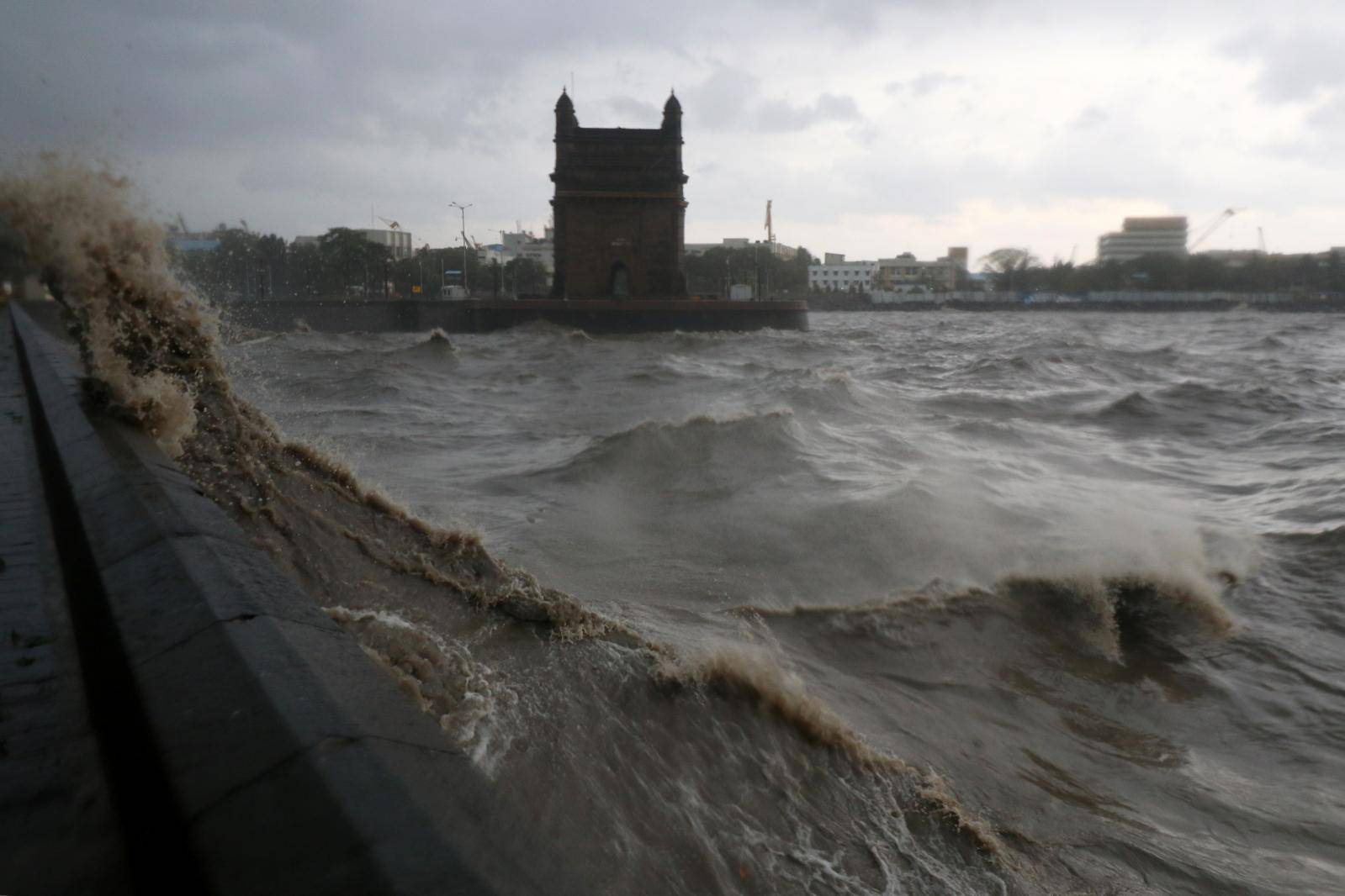 Waves caused by Cyclone Tauktae crash up on the promenade near the Gateway of India monument in Mumbai