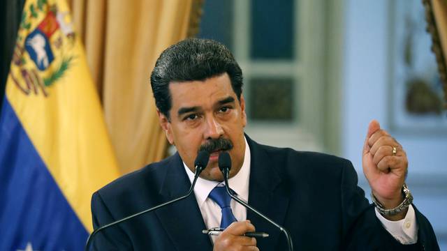 Venezuela's President Nicolas Maduro gestures during a news conference at Miraflores Palace in Caracas