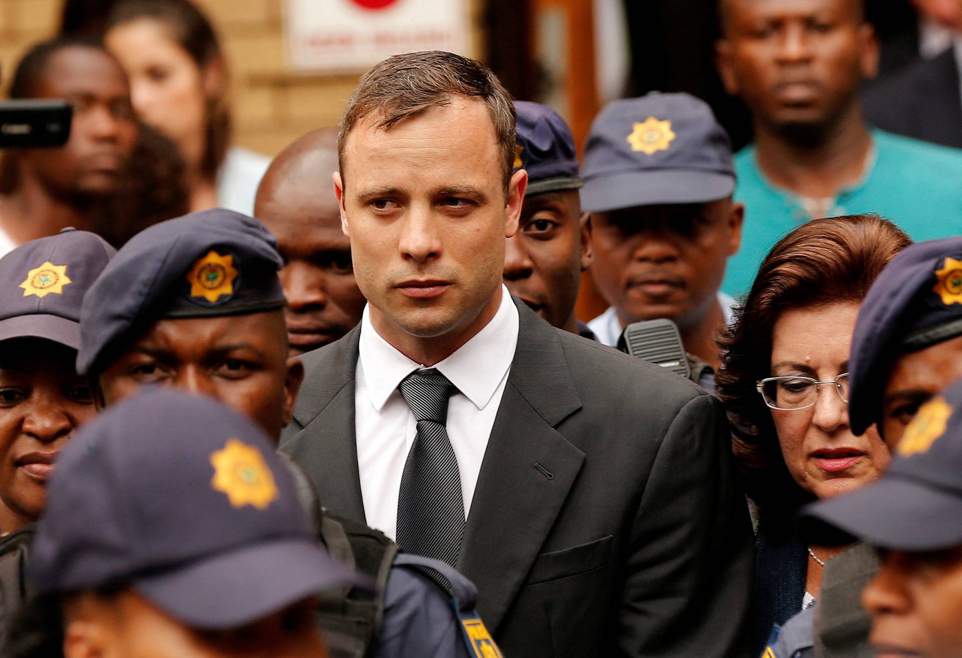 FILE PHOTO: South African Olympic and Paralympic sprinter Oscar Pistorius leaves the North Gauteng High Court in Pretoria