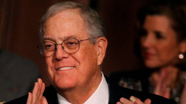 FILE PHOTO: David Koch, executive vice president of Koch Industries, applauds during an Economic Club of New York event in New York