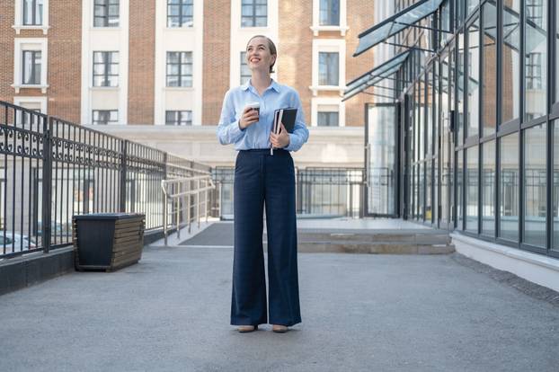 happy confident business woman, walk in city with coffee books