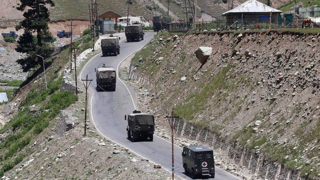Indian army convoy moves along Srinagar-Leh national highway, at Gagangeer, in east Kashmir's Ganderbal district