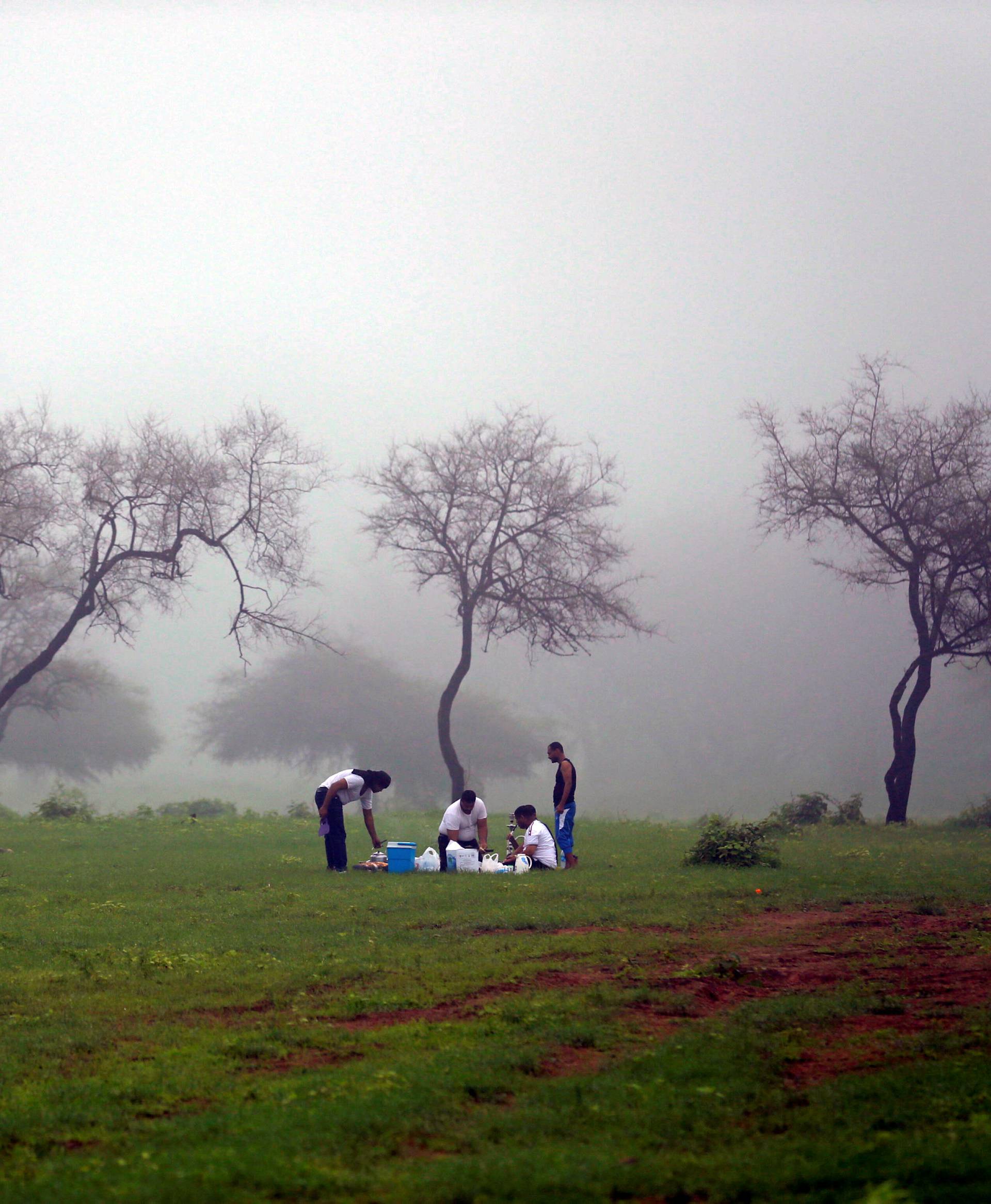 Tourists enjoy a picnic at Wadi Darbat in Salalah