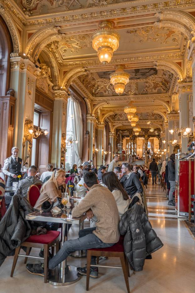 Budapest, Hungary - Feb 09, 2020: Tourists having brunch in Luxury New York Cafe
