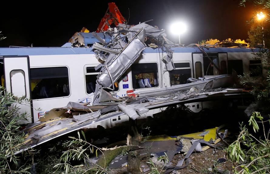 One of the two passenger trains collided in the middle of an olive grove is seen in the southern village of Corato