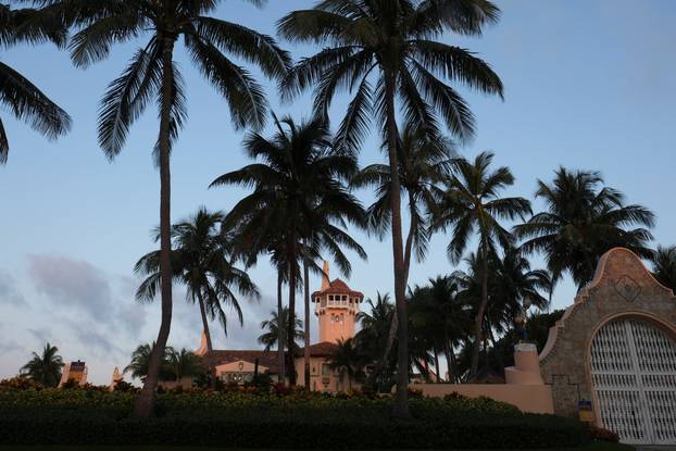 Supporters of former U.S. President Donald Trump gather outside his Mar-a-Lago resort after his indictment.