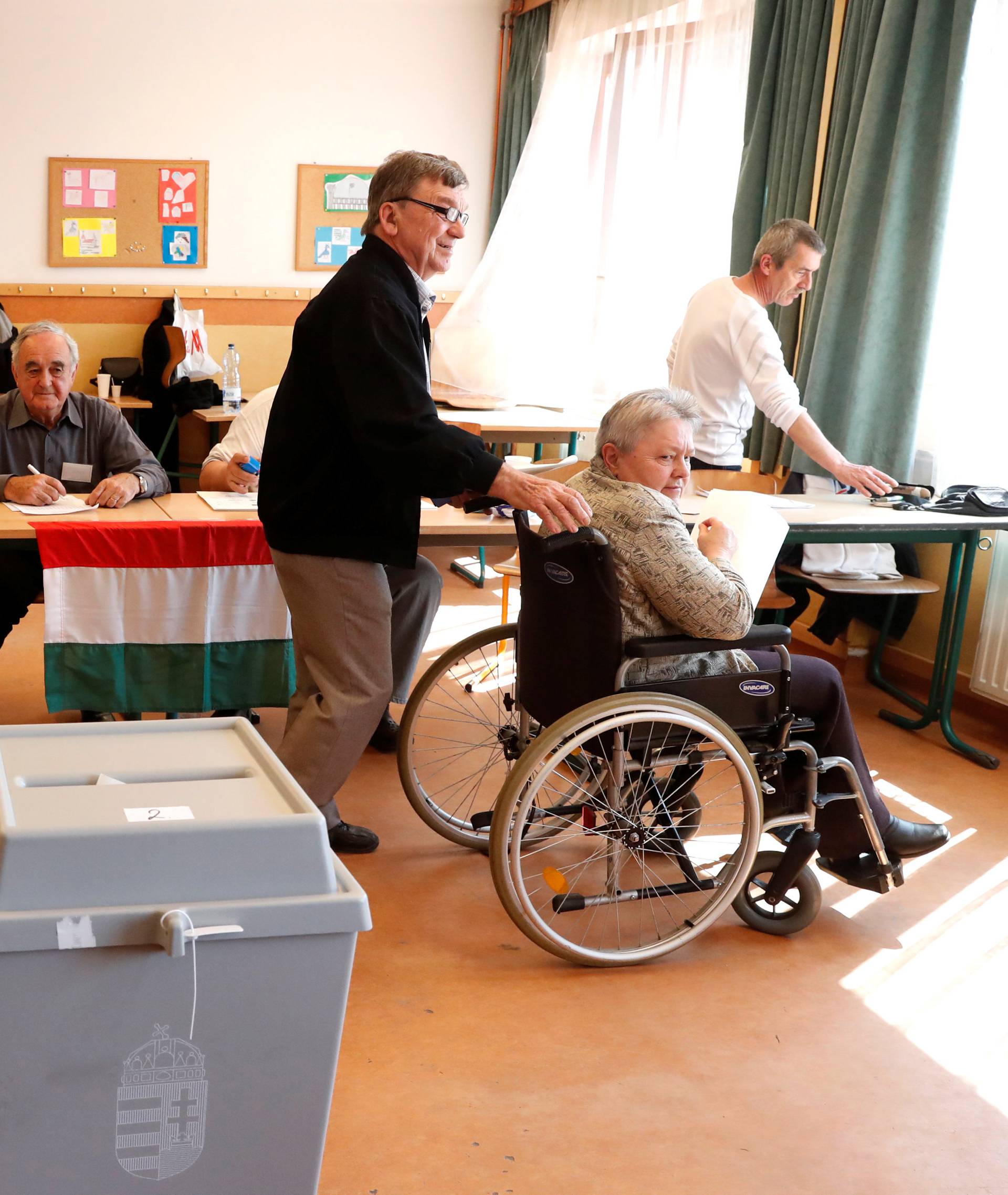 Hungarians attend the Hungarian parliamentary elections at a polling station in Veresegyhaz