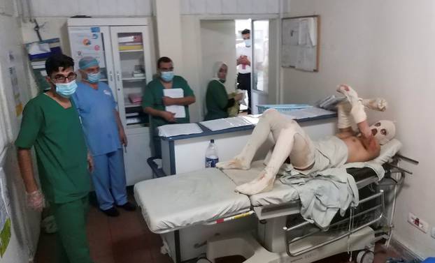 A man who was injured during a fuel tanker explosion in Akkar receives treatment in a hospital in Tripoli