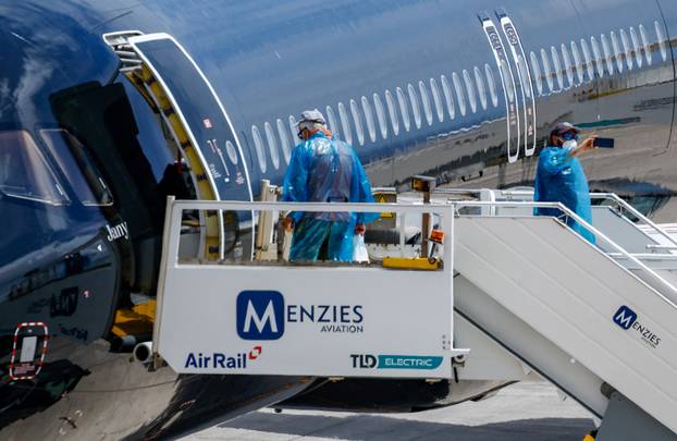 Passengers of the cruise ship MV Hondius, which was affected by a hantavirus outbreak, arrive at Tenerife Sud airport
