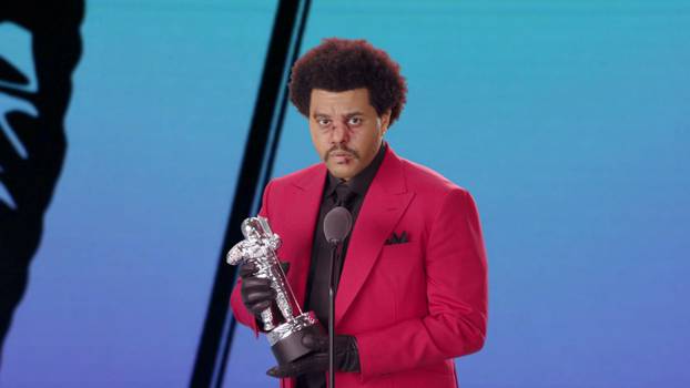 The Weeknd accepts the award for Best R&B during the 2020 MTV VMAs