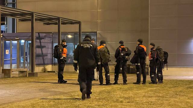 Finish border guards wait at the Nuijamaa border checkpoint in Finland