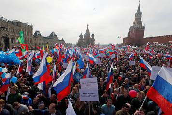 People attend a May Day rally at Red Square in Moscow