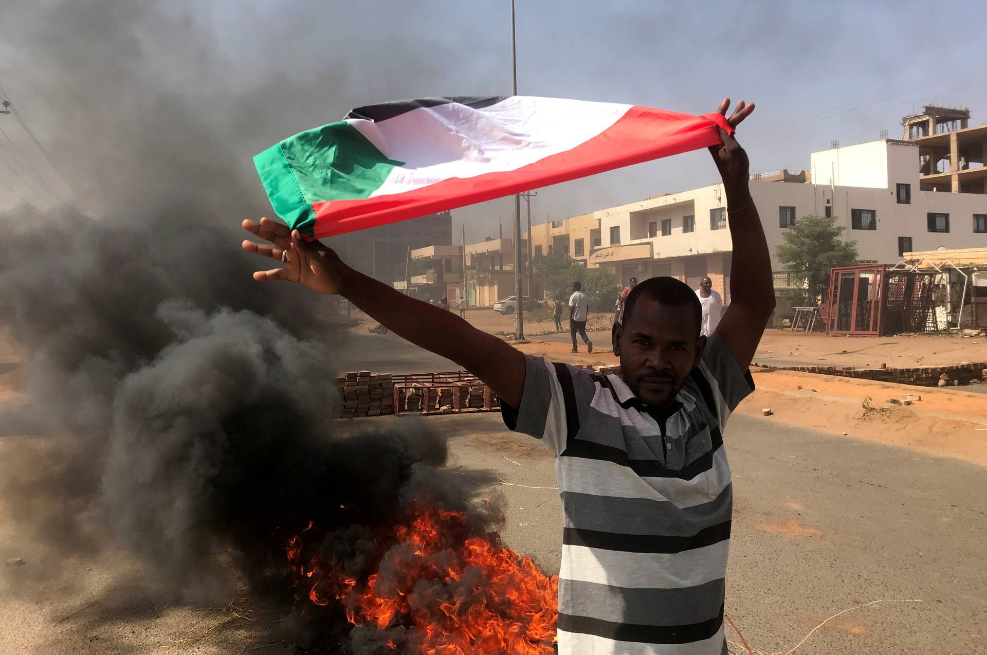 Protesters block a road in Khartoum