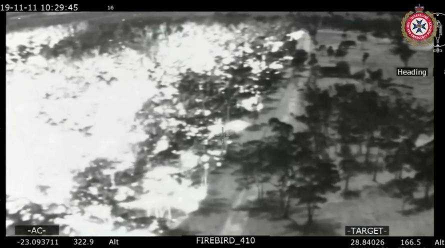 An aerial view in black and white shows the spread of bushfires in Queensland