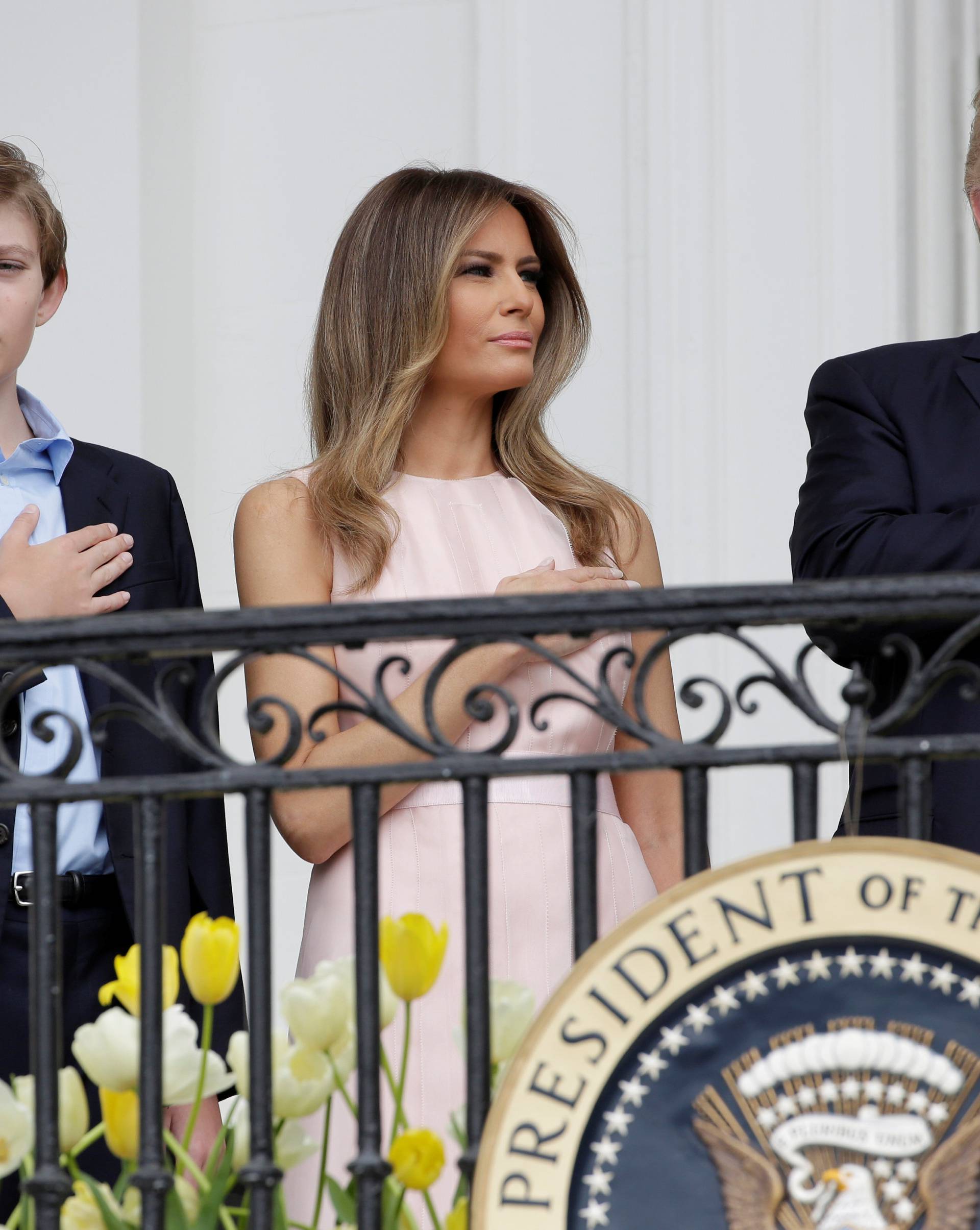 U.S. President Donald Trump, U.S. first lady Melania Trump and the their son Barron stand during the National Anthem at the 139th annual White House Easter Egg Roll on the South Lawn of the White House in Washington