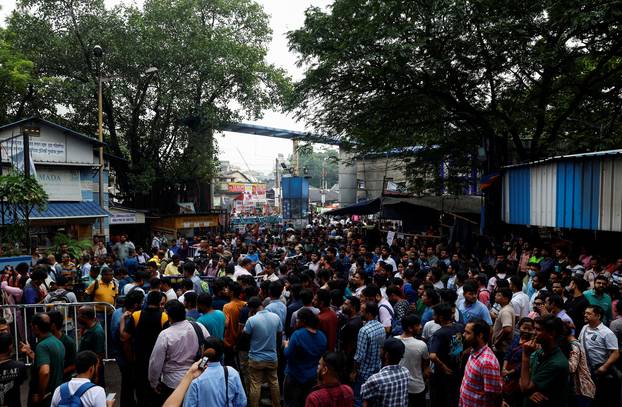 Doctors, paramedics and medical students gather as they attend a protest against what they say was rape and murder of a trainee doctor, inside the premises of R G Kar Medical College and Hospital in Kolkata