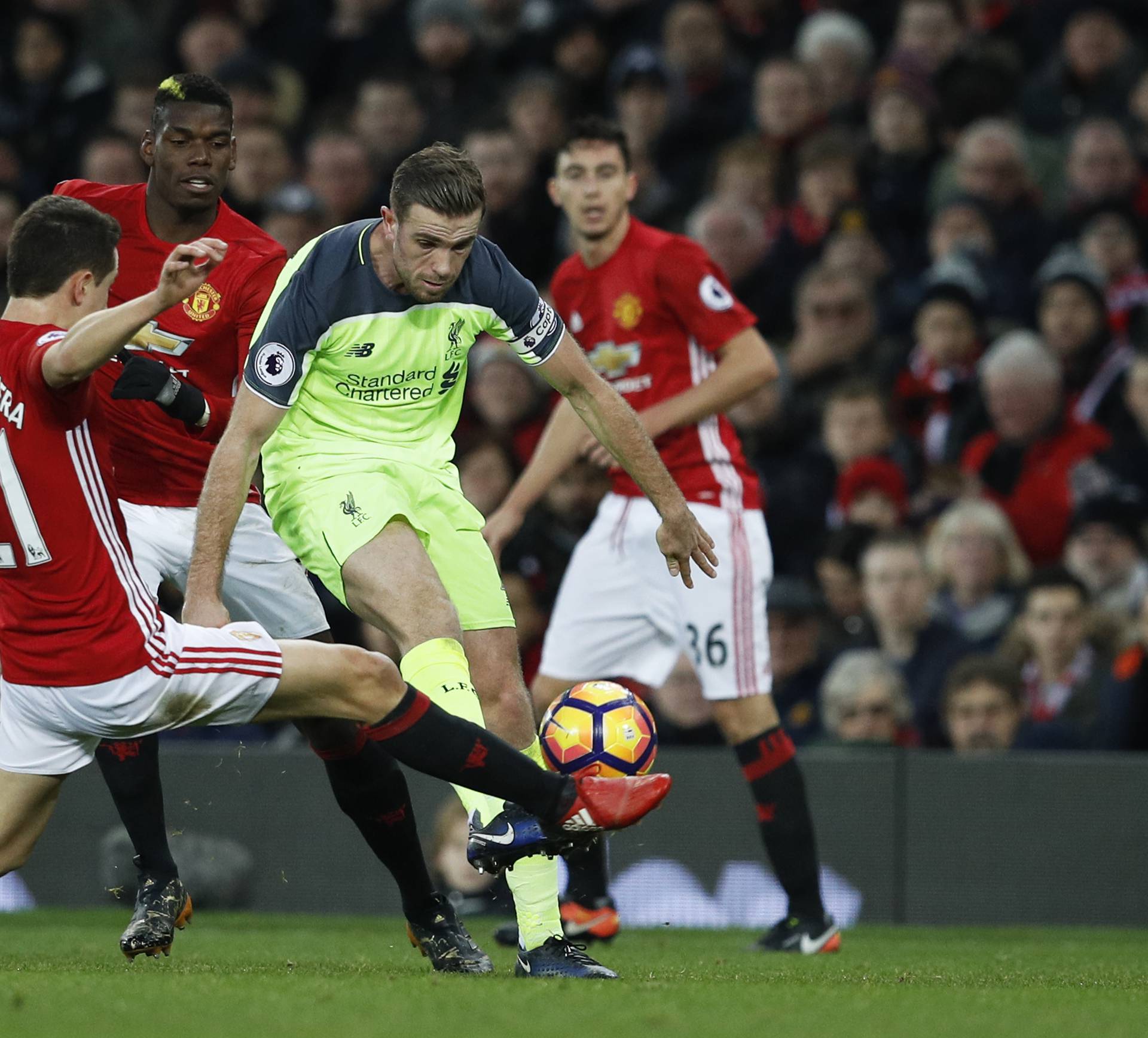 Liverpool's Jordan Henderson in action with Manchester United's Ander Herrera