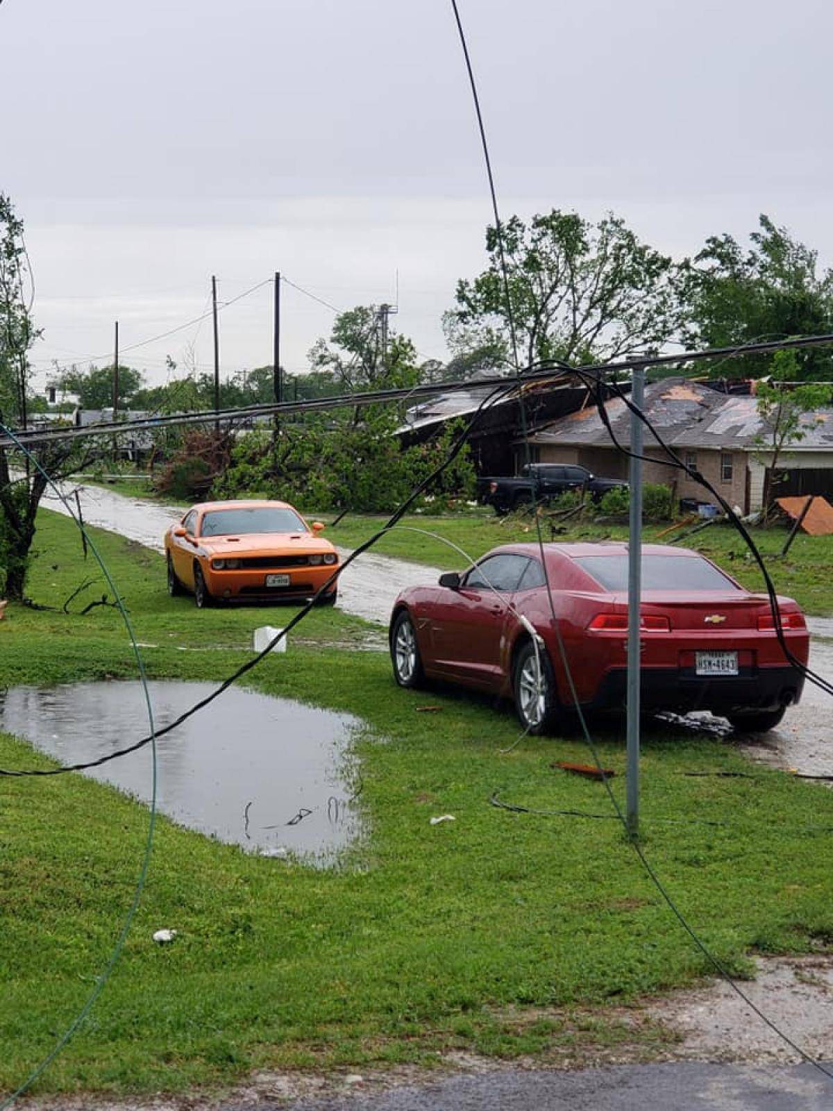 Cars and debris seen in the aftermath of a tornado in Franklin, Texas, U.S., in this image from social media