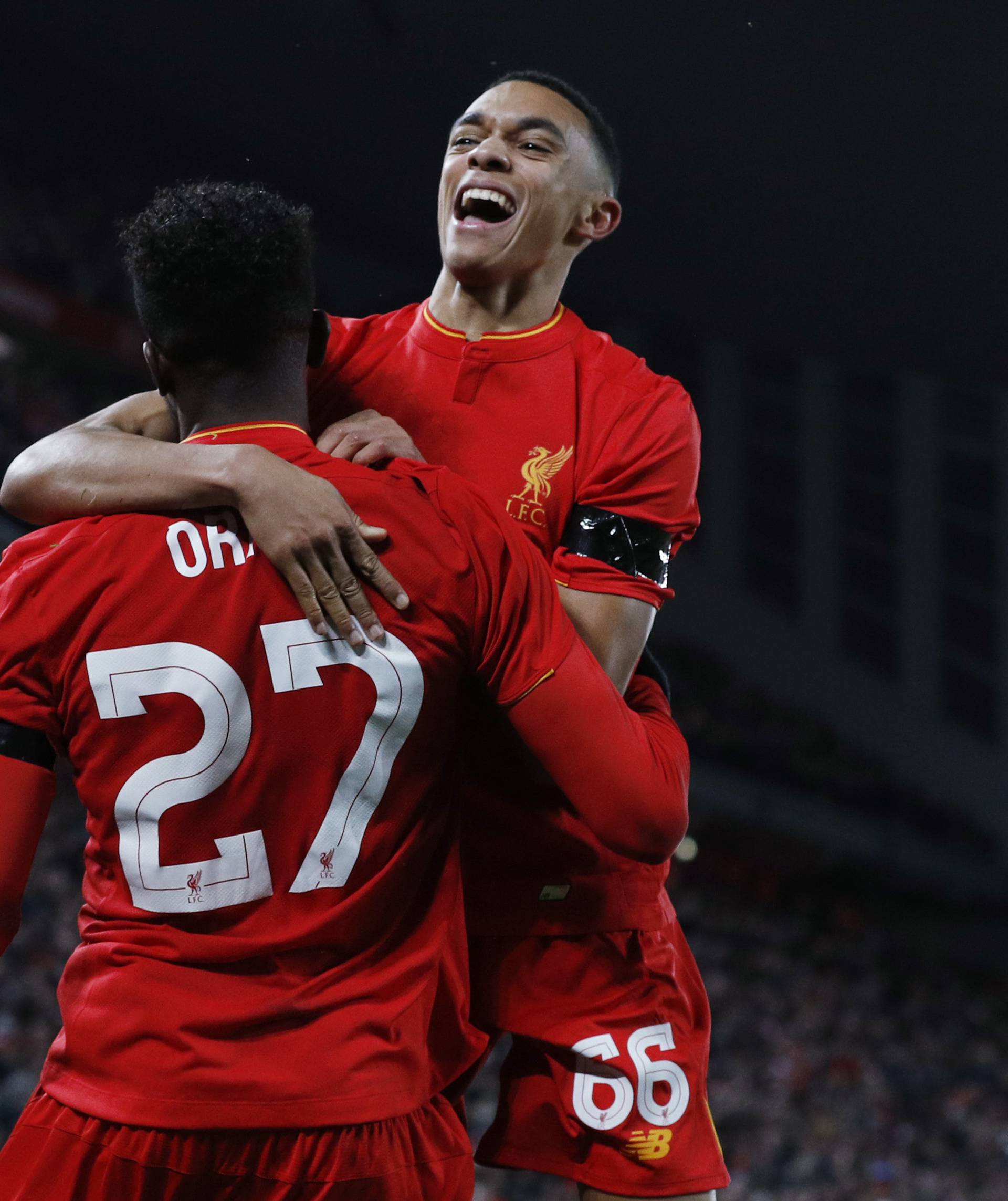 Liverpool's Divock Origi celebrates scoring their first goal with Trent Alexander-Arnold