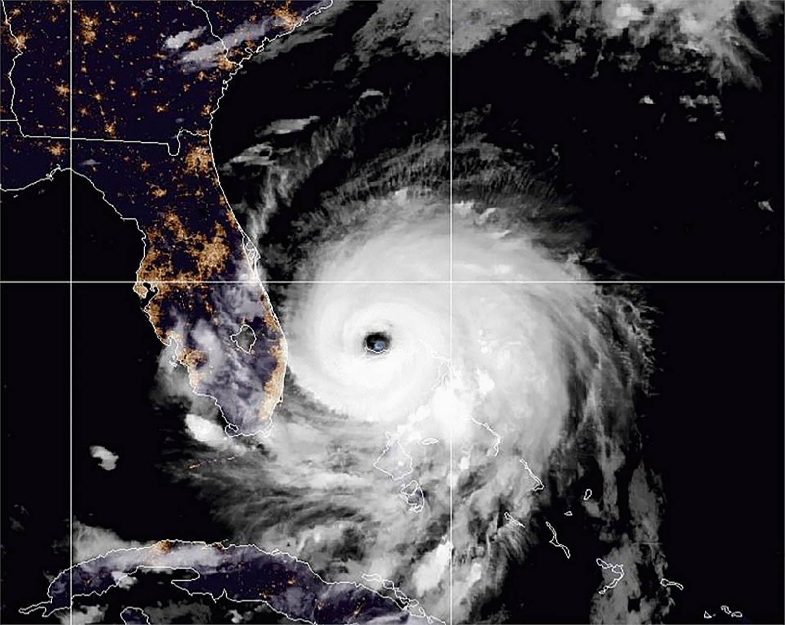 The eye of Hurricane Dorian remains near the city of Freeport, Bahamas in a satellite photograph distributed by the NOAA's National Weather Service