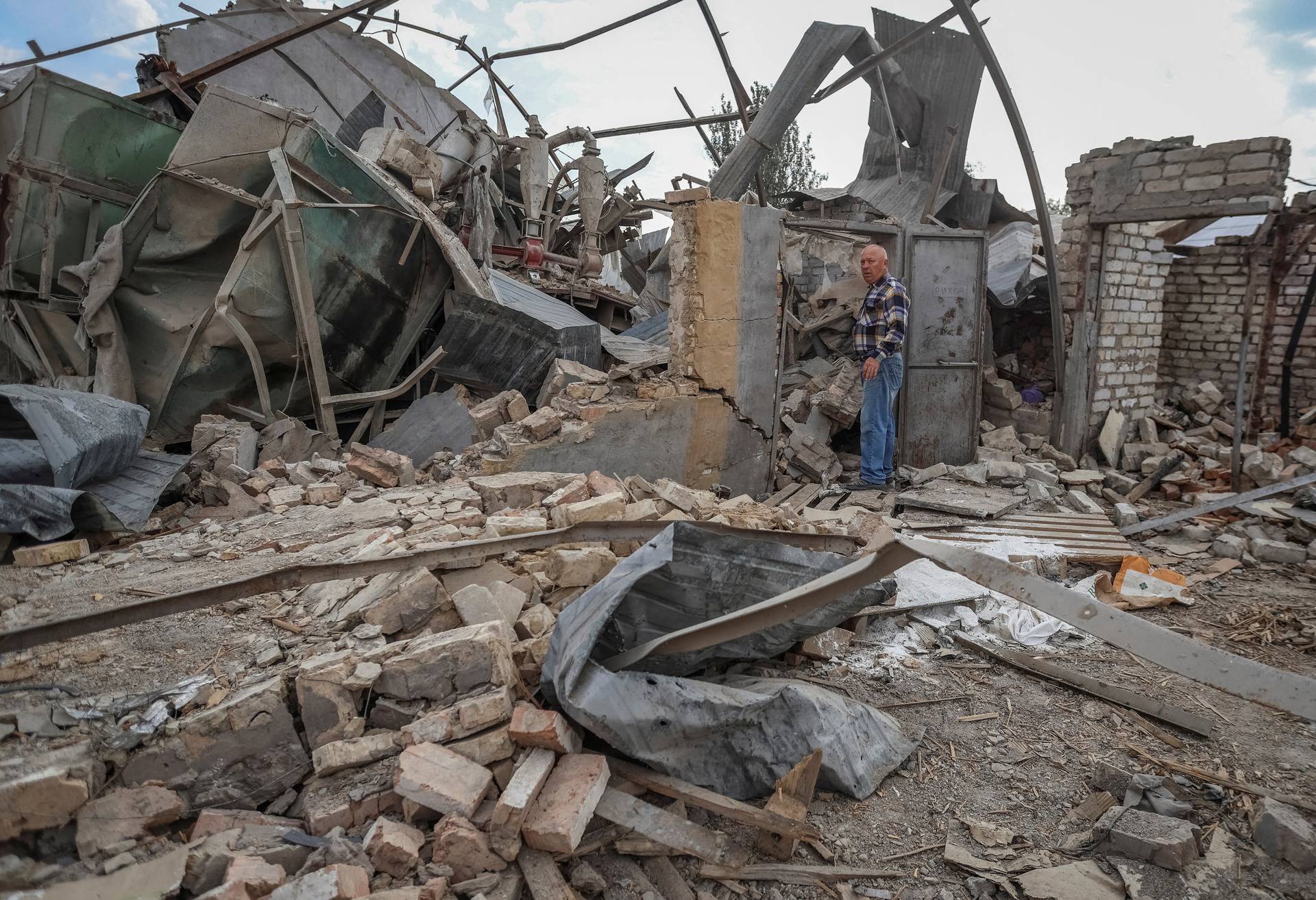 Ukrainian farmer visits his crop storage that was destroyed by Russian military strike near a frontline outside Orikhiv