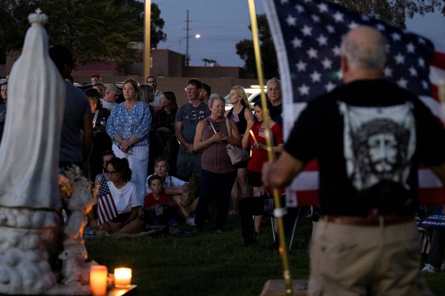Catholics from across the Phoenix area gather to pray for Charlie Kirk, who was shot and killed in Utah, at Desert Horizon Park in Scottsdale