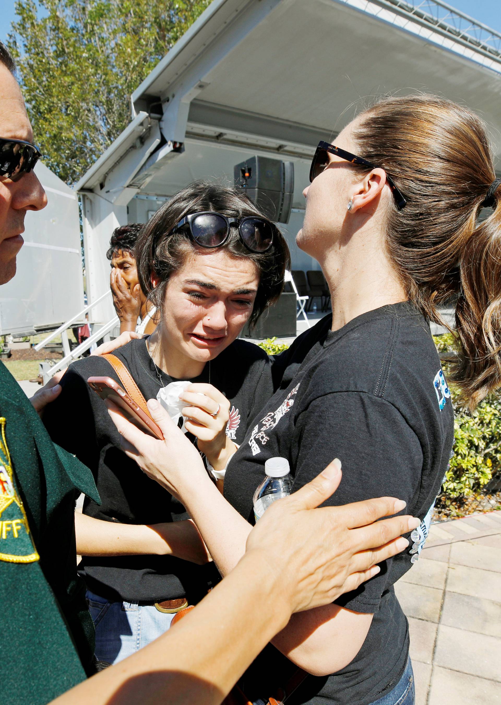 Student mourns at a community prayer vigil at Parkridge Church in Pompano Beach