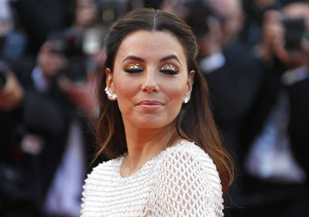 Actress Eva Longoria poses on the red carpet as she arrives for the opening ceremony and the screening of the film "Cafe Society" out of competition during the 69th Cannes Film Festival in Cannes