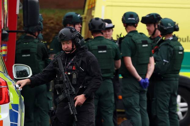 Emergency personnel work at the scene following an incident outside a synagogue, in Manchester