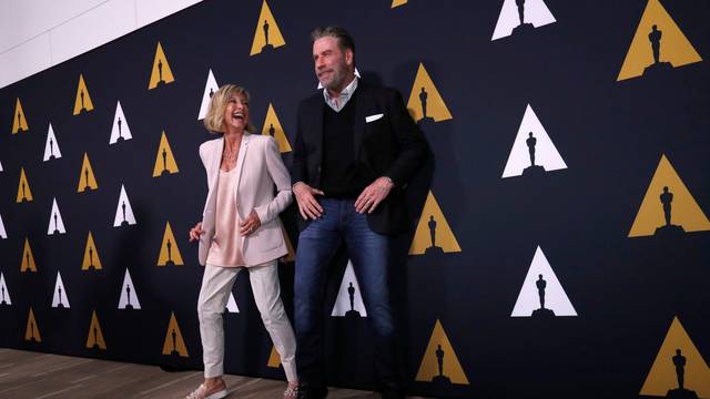 Cast members Travolta and Newton-John dance at a 40th anniversary screening of "Grease" at the Academy of Motion Picture Arts and Sciences in Beverly Hills