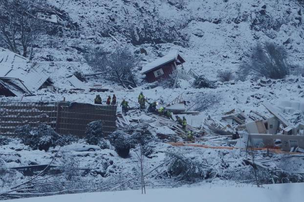Rescue crews work in the area two days after a large landslide occurred in Ask