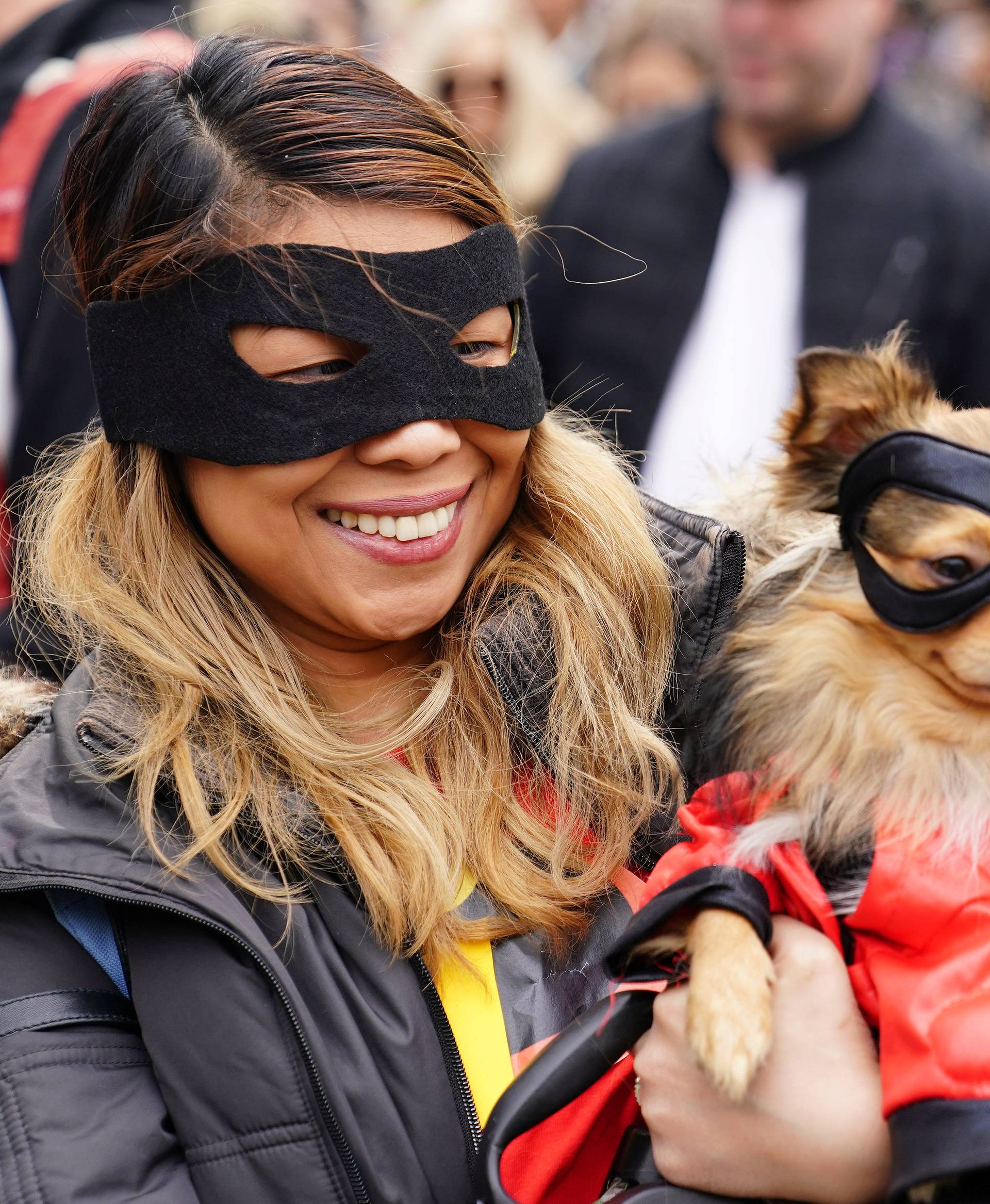 People attend the Tompkins Square Park Halloween Dog Parade at East River Park in the Manhattan borough of New York City
